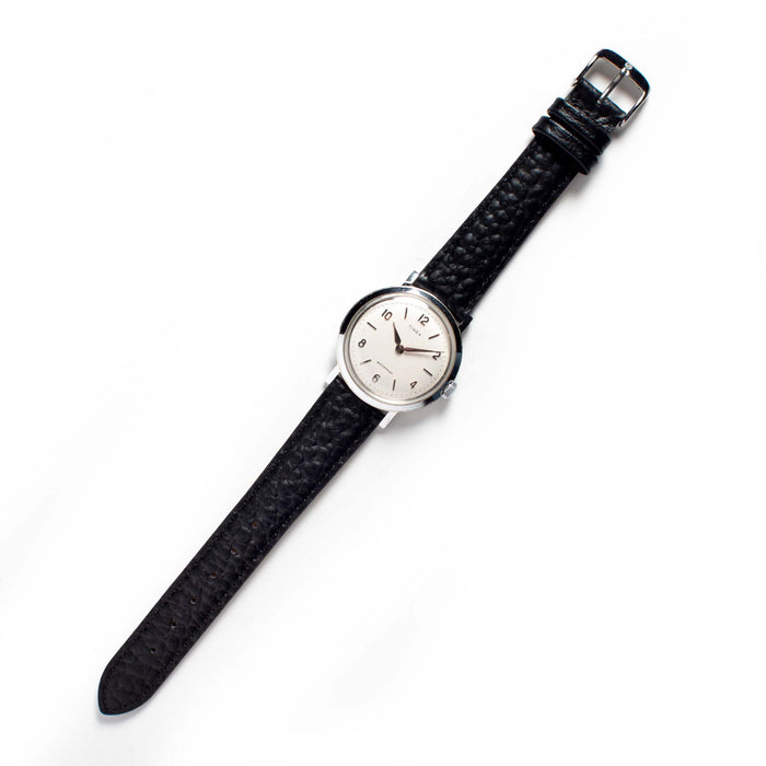 flatlay of The 1960 Timex Marlin Aluminum