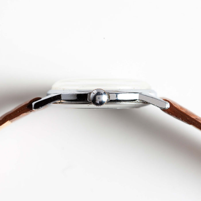 material shot of the side of the watchface on The 1966 Timex Mercury