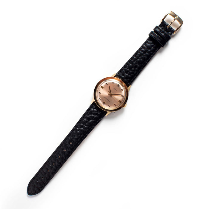 flatlay of The 1972 Timex Marlin Gold