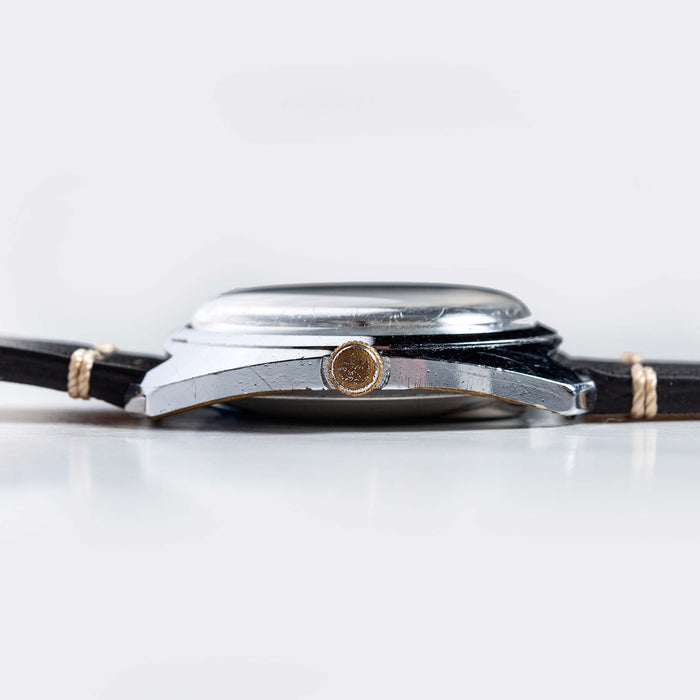 flatlay of 1975 Timex Electric Dynabeat "Rotary", from the side