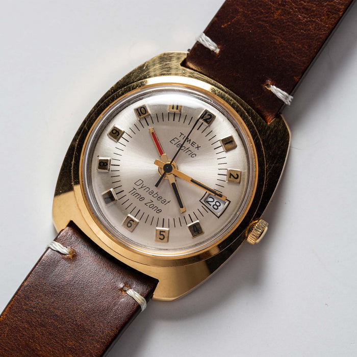 flatlay of the 1975 Timex Electric Dynabeat Time Zone,s hown close up