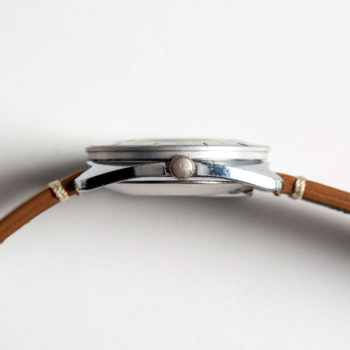 flatlay of 1976 Timex Electric Dynabeat, shown from the side