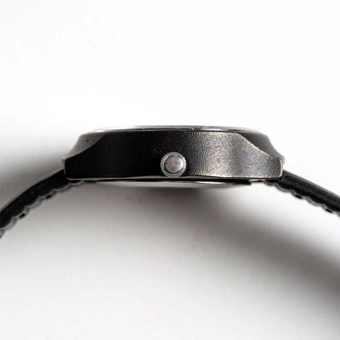 flatlay of the 1977 Timex Black Max, shown from the side