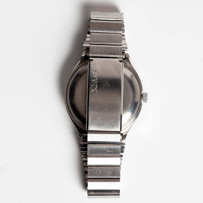 flatlay of the 1977 Timex Blue Dial Q Quartz, from the back