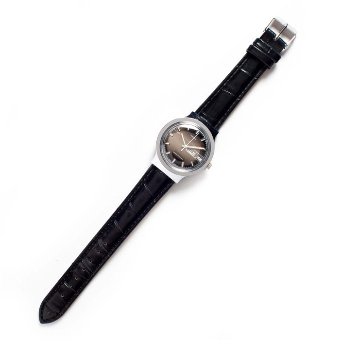 flatlay of the 1977 Timex Marlin M106