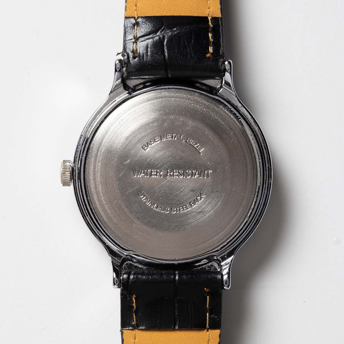flatlay of the 1977 Timex Marlin M106, shown from the back