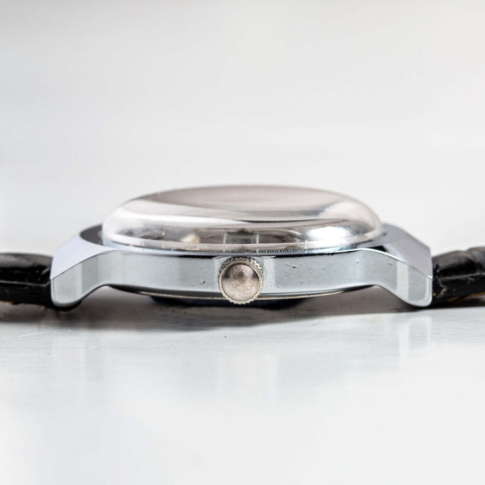 flatlay of the 1977 Timex Marlin M106, shown from the side