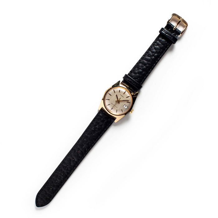 flatlay of the 1978 Timex Gold Marlin
