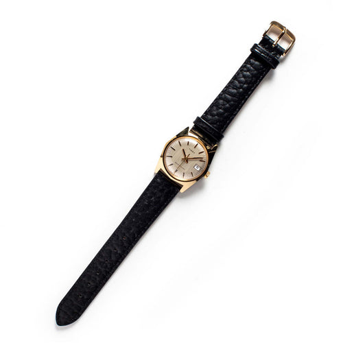 flatlay of the 1978 Timex Gold Marlin