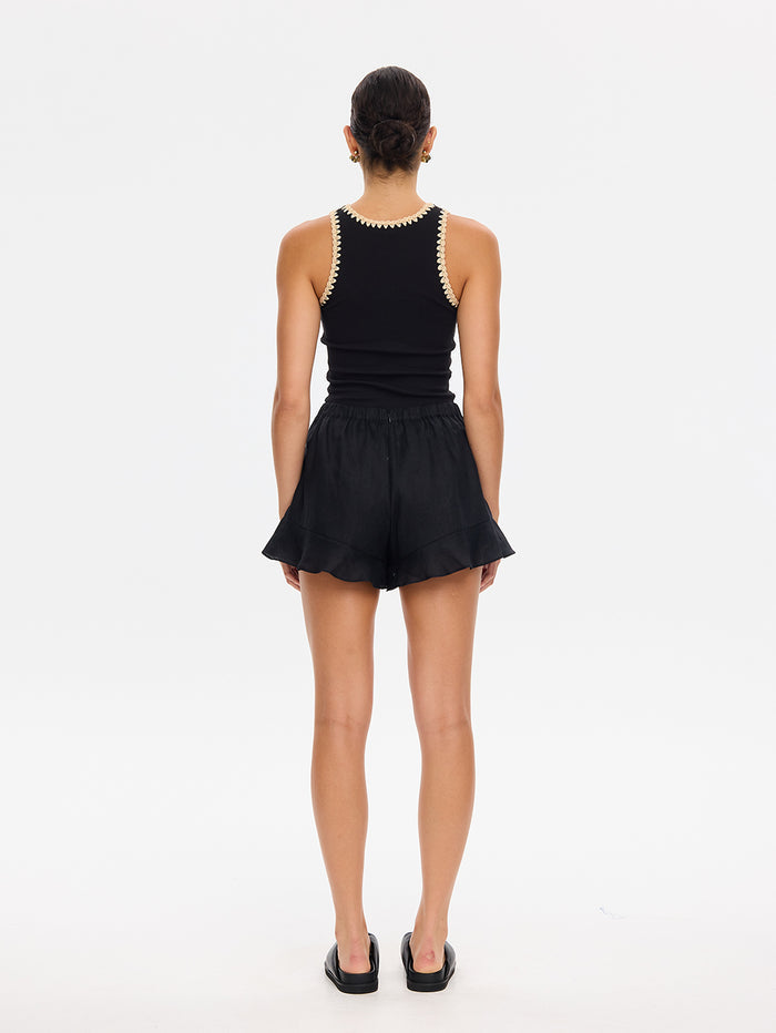 KIVARI Azarea black tank top and shorts set, back view with mule sandals