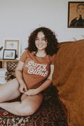 Woman sat on sofa wearing Brown Carry As You Climb Shirt for Women by The Bee and The Fox