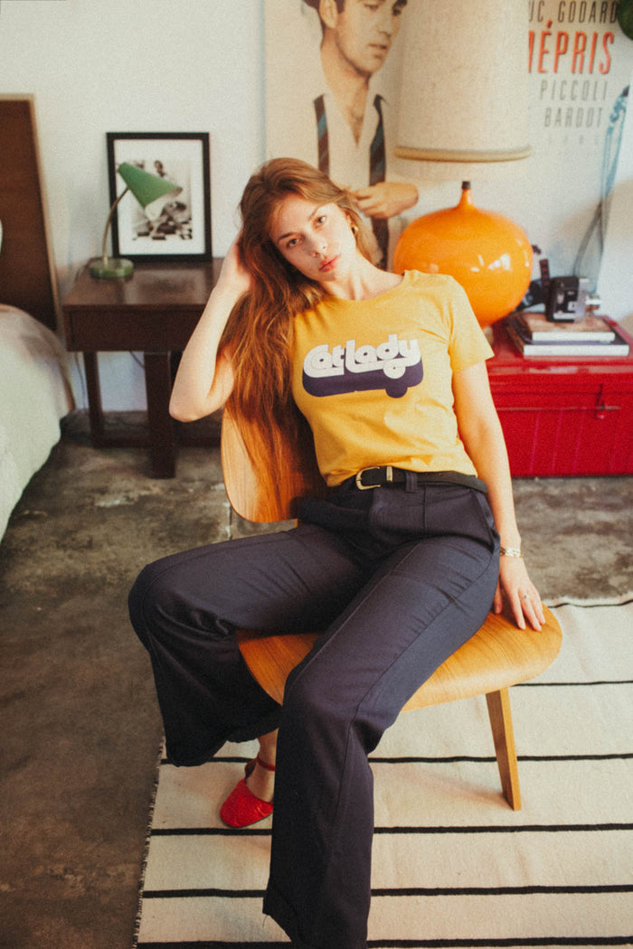 Woman wearing orange "Cat Lady" shirt
