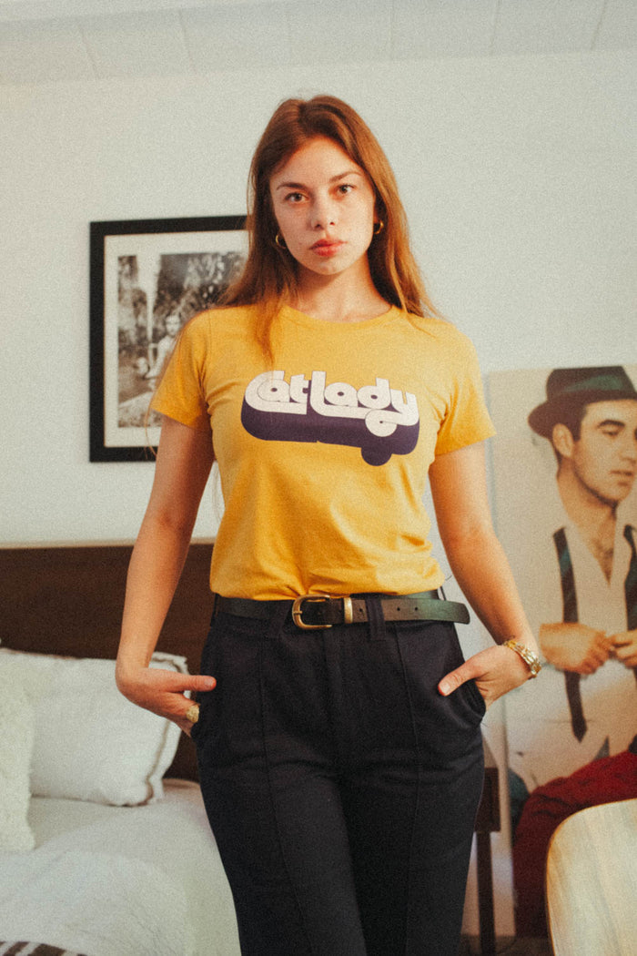Woman wearing orange "Cat Lady" shirt