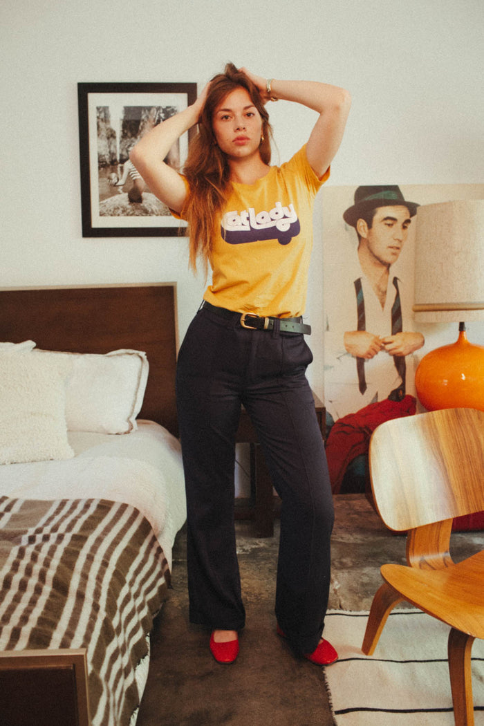 Woman wearing orange "Cat Lady" shirt
