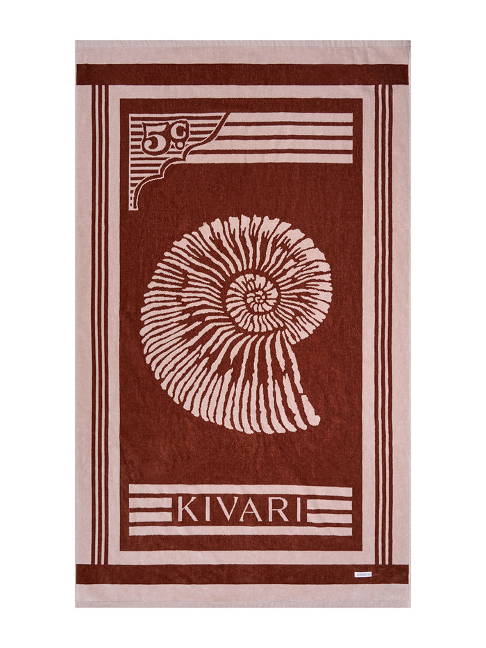 Kivari towel with shell design on a brown background