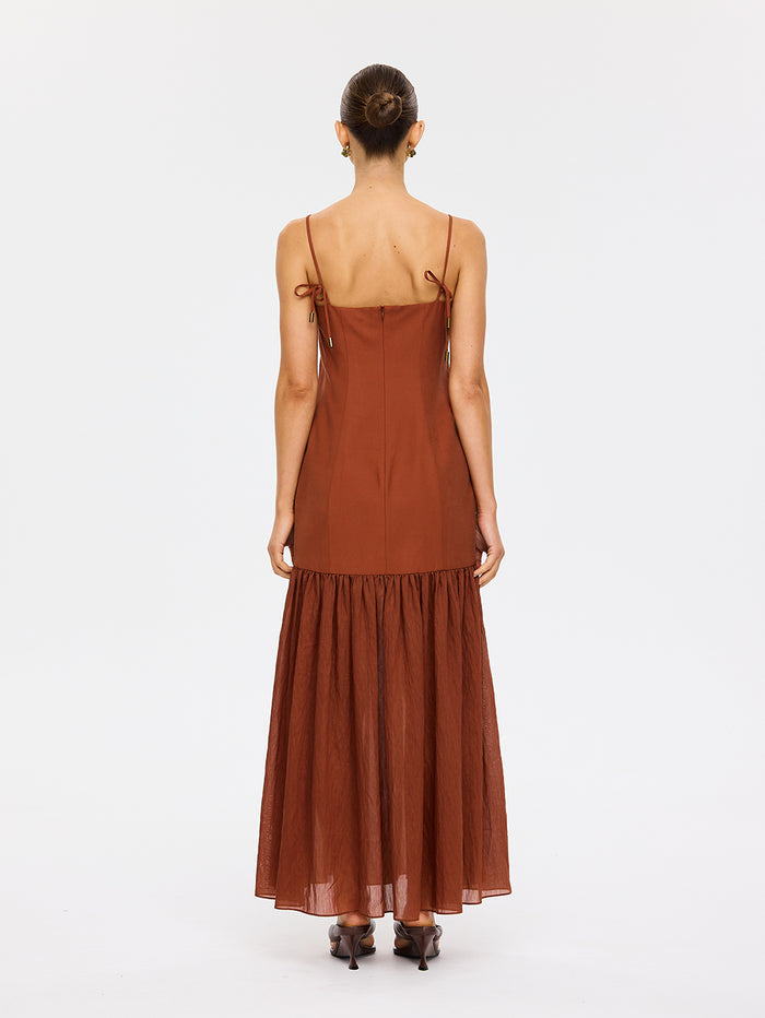 KIVARI Elanor Maxi Dress in Hazel – back view of model wearing women's hazel spaghetti strap tiered maxi dress showing tie straps