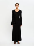Woman wearing a black dress on a white background