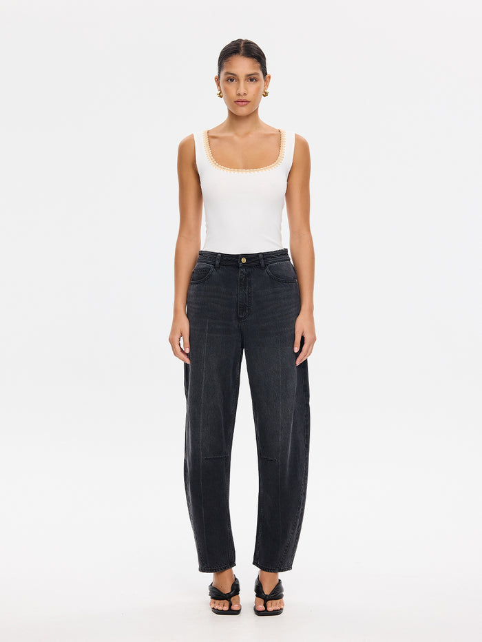KIVARI Esme ivory scoop-neck tank top with wide-leg denim jeans and sandals, front view