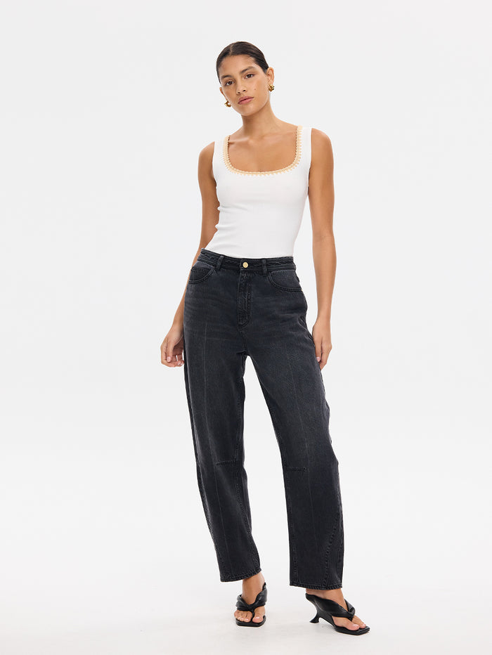 KIVARI Esme ivory scoop-neck tank top with wide-leg black denim jeans, full-length view