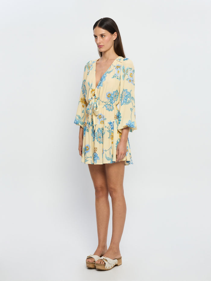 Giselle Tie Front Mini Dress KIVARI | Model wears blue and yellow tie front mini dress side view