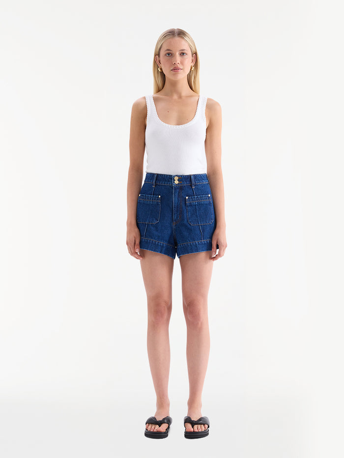 KIVARI Hanna denim shorts with white tank top and black sandals, front view
