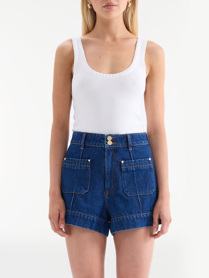 KIVARI Hanna denim shorts close-up with white scalloped-trim tank top