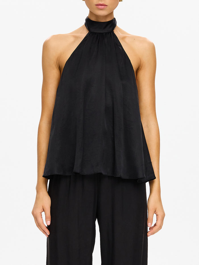KIVARI Jaxon Halter Top in Black – close-up of model wearing women's black halter neck top with wide-leg pants