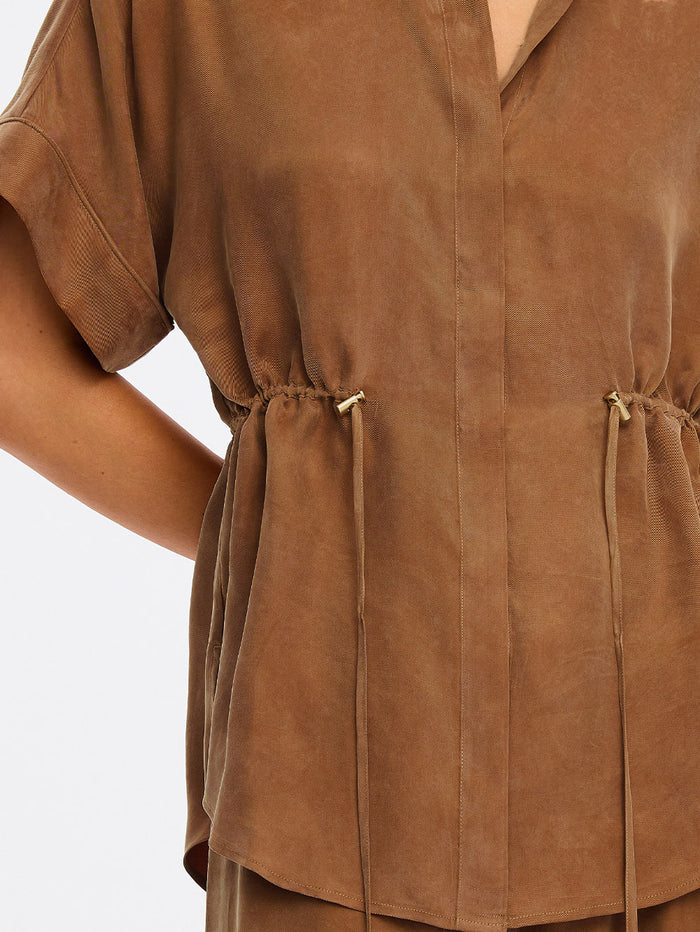 Brown Top close up image with a plain background