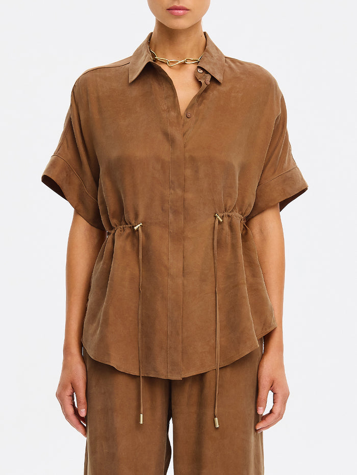 Brown outfit with a matching top and pants on a white background