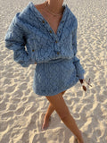 KIVARI blue quilted embroidered denim jacket and skirt set - influencer wearing co-ord on sandy beach, lifestyle photo