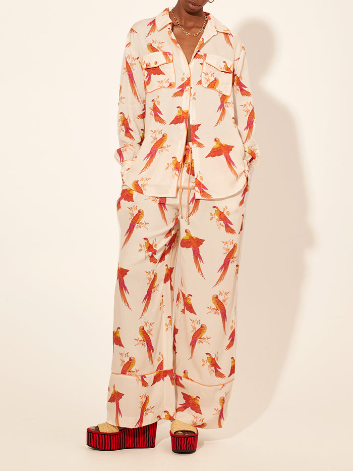 Kaylee Pant KIVARI | Model wears pink and orange bird printed pants