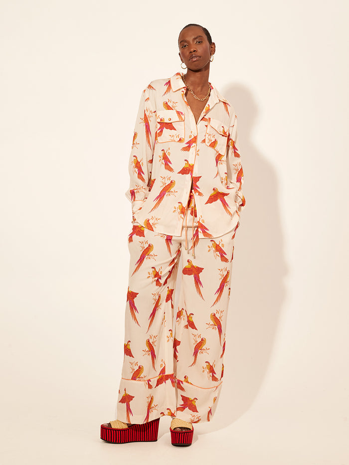 Kaylee Pant KIVARI | Model wears pink and orange bird printed pants