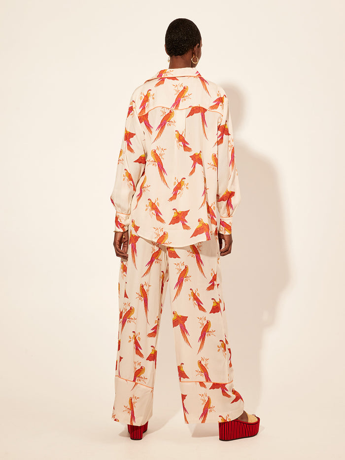 Kaylee Pant KIVARI | Model wears pink and orange bird printed pants back view