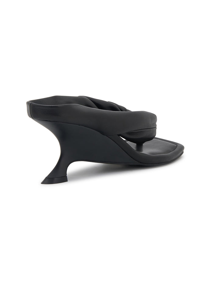 Black wedge sandal on a white background