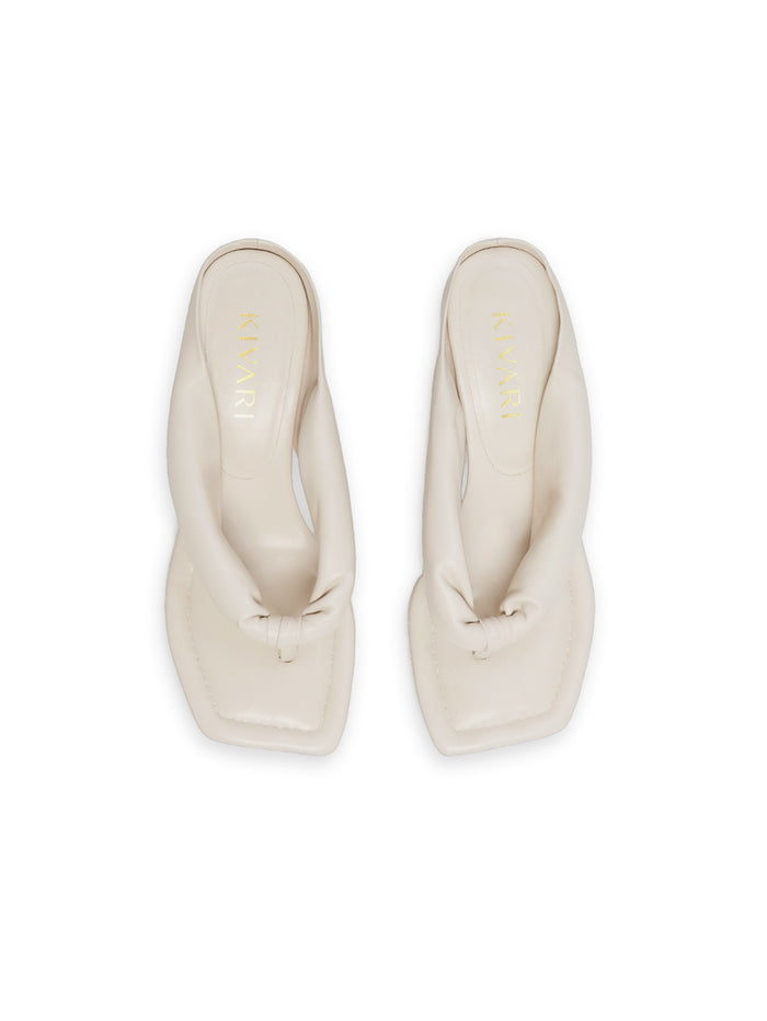 Pair of white heels on a white background