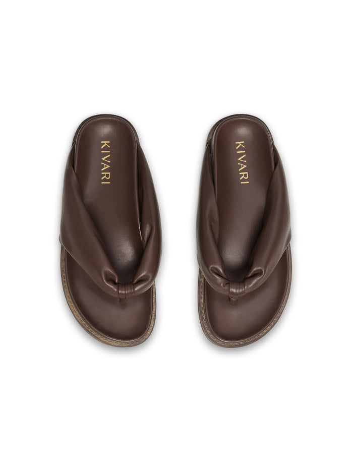 Brown sandals with 'Kivari' branding on a white background