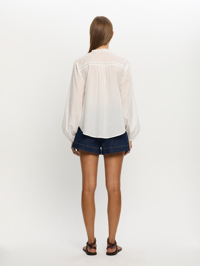 Woman in white blouse
