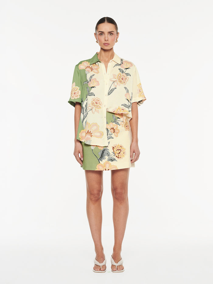 Lotte Shirt in Green Cream, front view of matching floral print shirt and mini skirt set