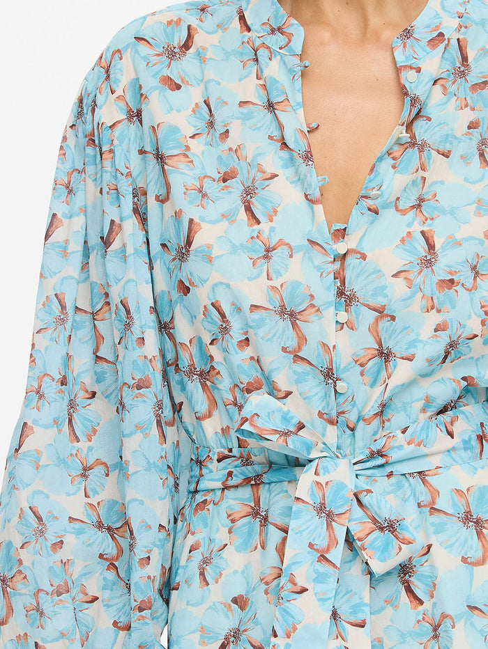 KIVARI Lydia Playsuit in Mint - upper body close-up showing V-neckline and tie front on teal floral playsuit