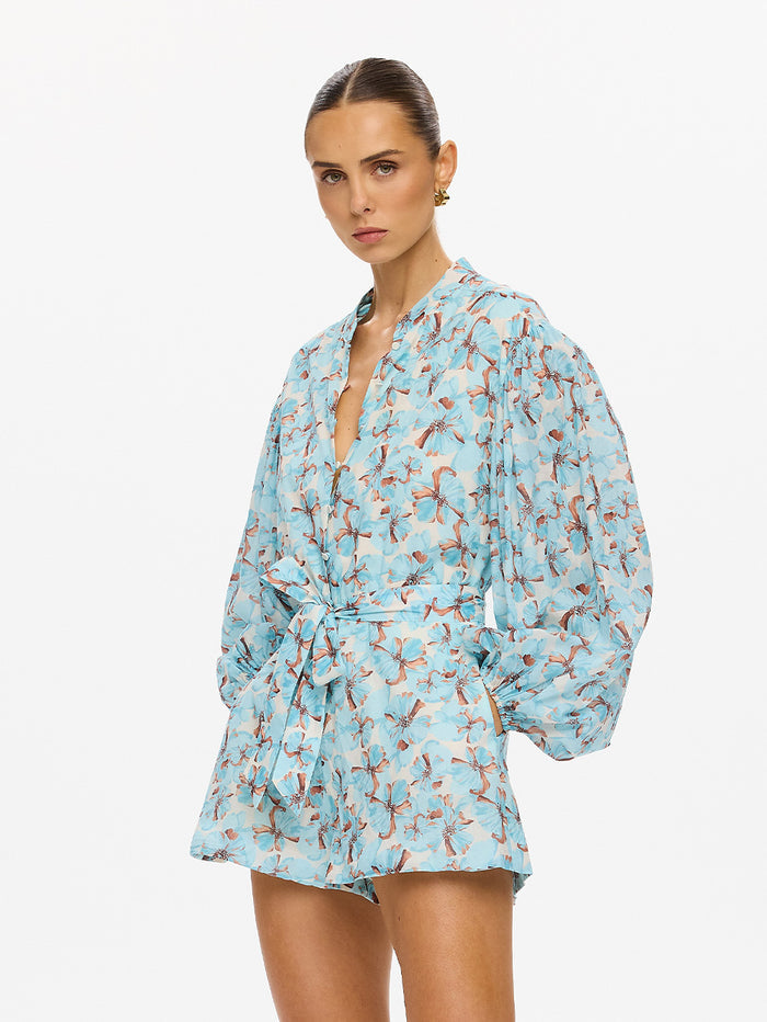 KIVARI Lydia Playsuit in Mint - 3/4 angle view of model in mint teal floral print long-sleeve playsuit