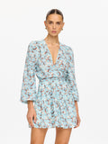 KIVARI Lydia Tie Front Mini Dress in Mint - upper body view of model in teal floral print V-neck mini dress