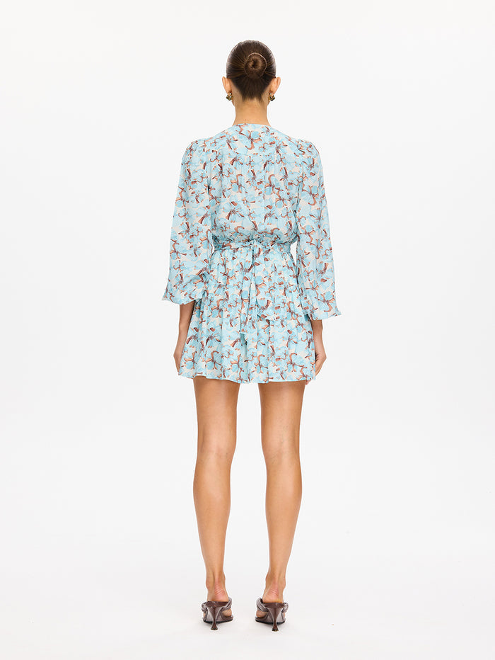 KIVARI Lydia Tie Front Mini Dress in Mint - back view of model in teal floral print long-sleeve mini dress