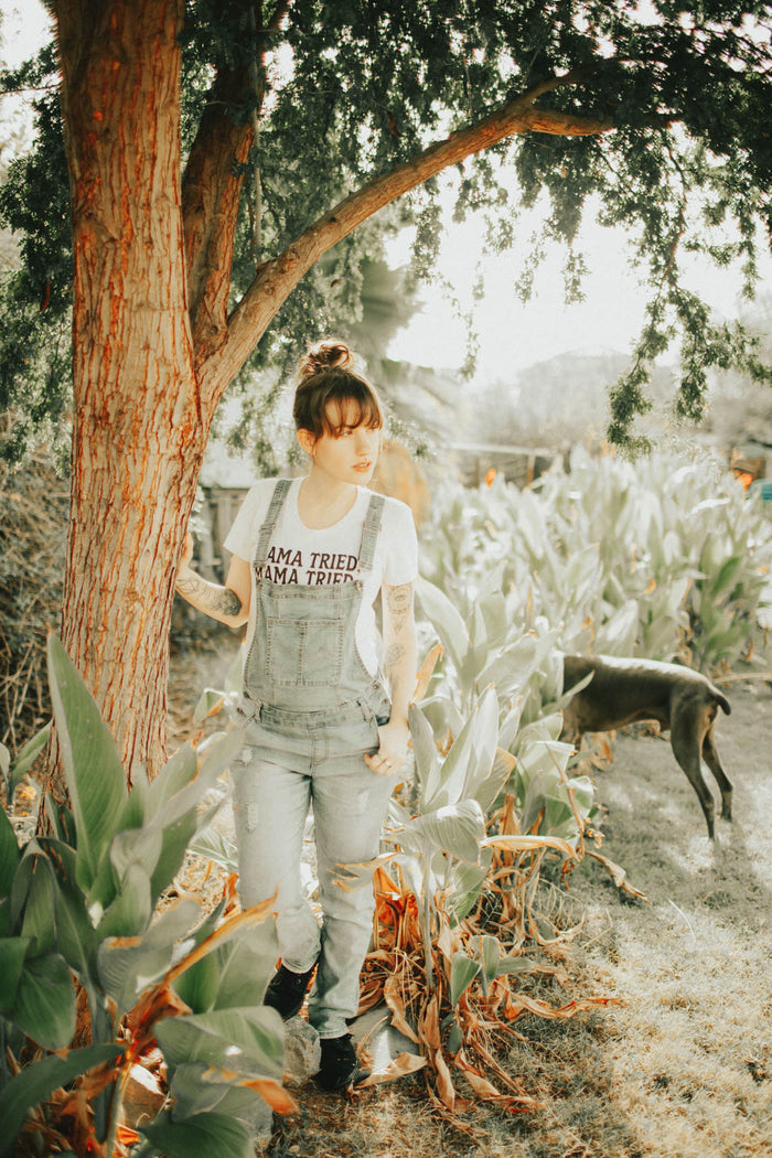 Woman stood next to tree in Mama Tried Scoop Neck Shirt for Women by The Bee and The Fox