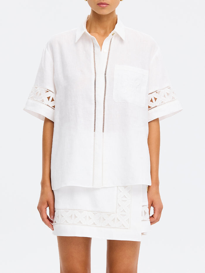 White dress with embroidery on a white background
