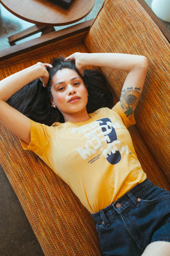 Woman wearing MOM! Overstimulated Moms Club shirt