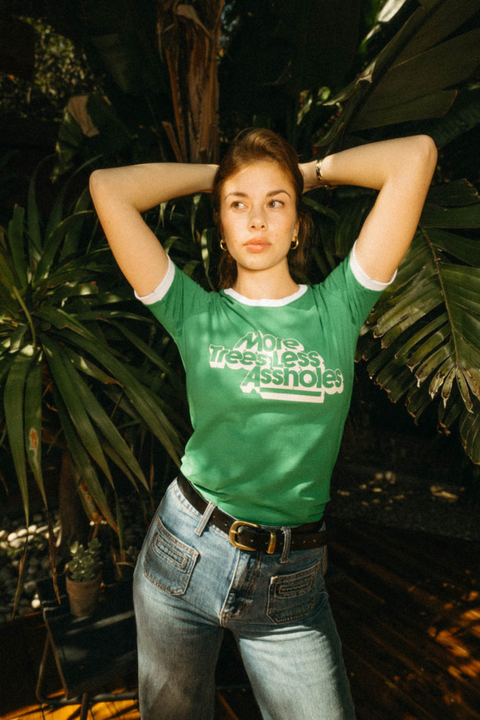 Woman wearing More Trees, Less Assholes ringer tee shirt