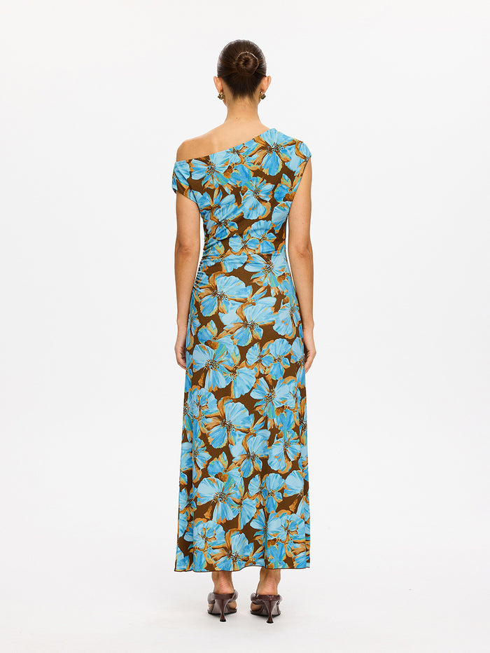 KIVARI Nieve Jersey Maxi Dress in Blue - back view of model wearing blue and brown floral one-shoulder jersey maxi dress