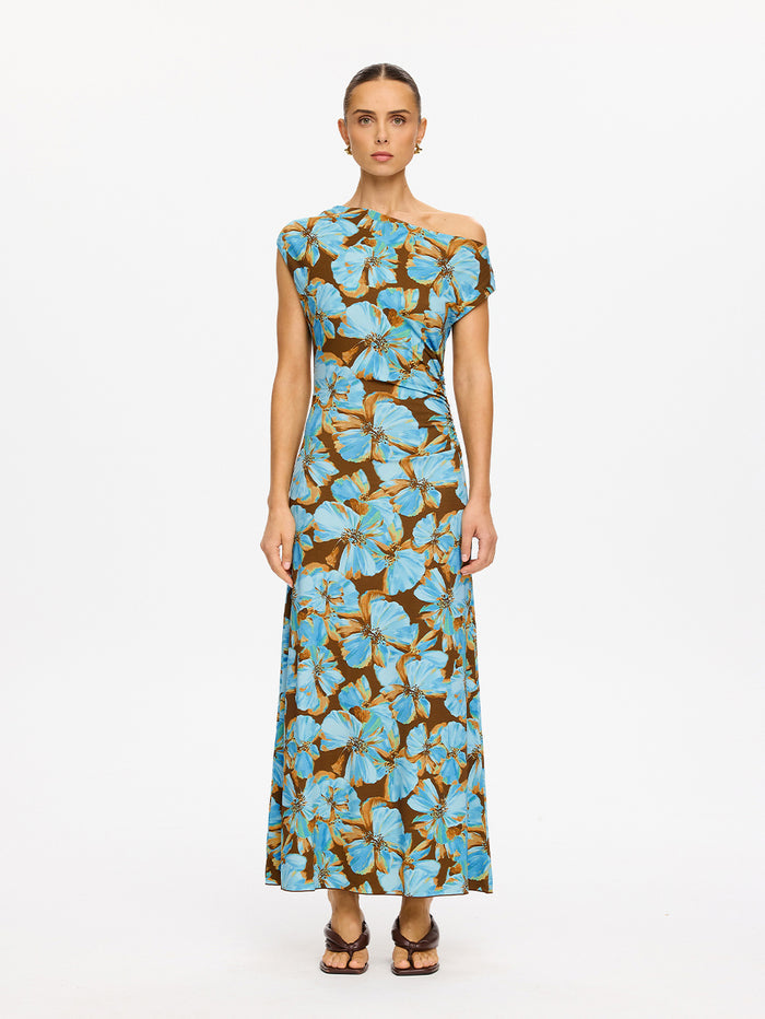 KIVARI Nieve Jersey Maxi Dress in Blue - front view of model wearing blue and brown floral one-shoulder jersey maxi dress