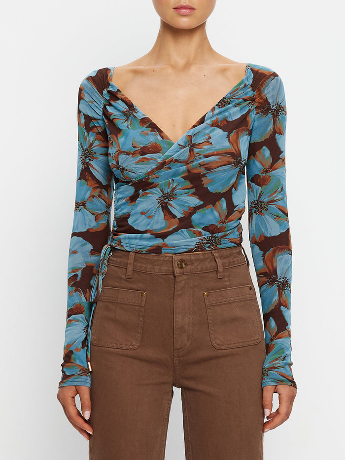 KIVARI Nieve Mesh Top in Blue Floral Print – close-up of women's long-sleeve wrap mesh top showing neckline detail