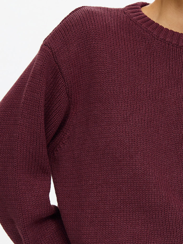 KIVARI Odette Crew Neck Jumper in Plum – close-up detail shot showing ribbed knit texture and crew neckline of women's dark plum knit sweater